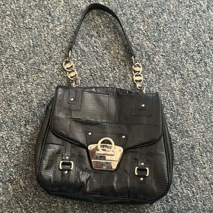 Salvatore Ferragamo black leather bag, good for party or work, professional use.